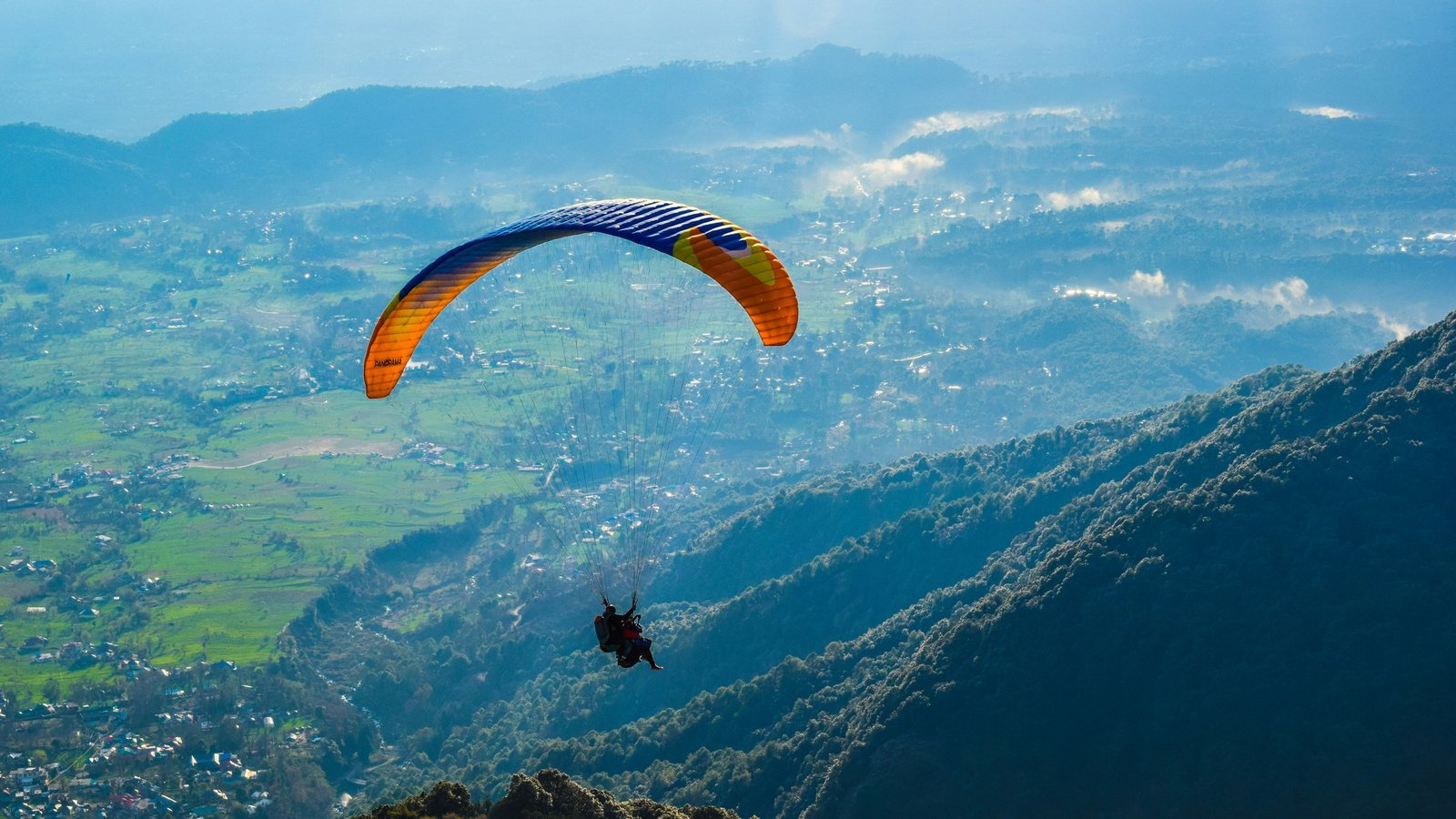Traveller paragliding on a special interest adventure tour